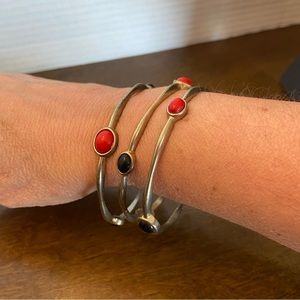 3 goldtone bangle bracelets with red and black beads